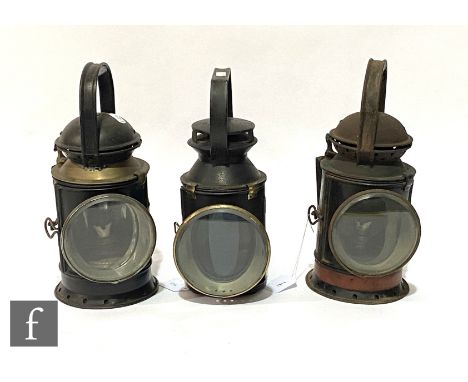 A Fogmans black painted hand lamp with orange band to base, height 31cm, a GWR hand lamp and a BR(W) hand lamp. (3) 