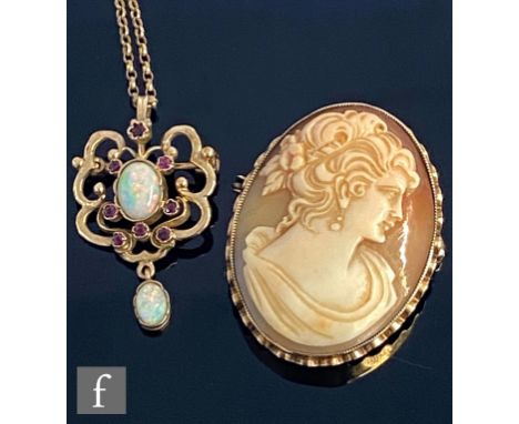 A modern opal and ruby open work pendant/brooch suspended from a belcher link chain, total weight 5.5g, with a 9ct oval cameo