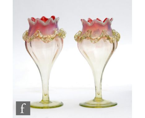 A pair of late 19th Century Sunrise opal posy vases of tulip form in a graduated cranberry to citron glass with opalescence a