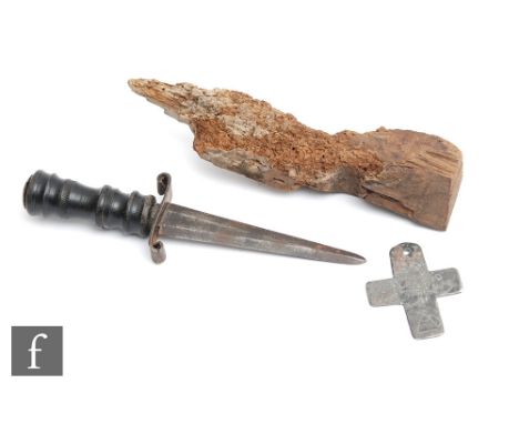 A crudely worked lead cross inscribed 'Death to ye King' with axe and block, height 7cm, also a piece of wood from a beam fou