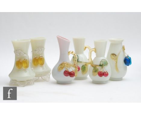 A small collection of late 19th Century applied fruit vases to comprise two matched pairs and two singles all decorated with 