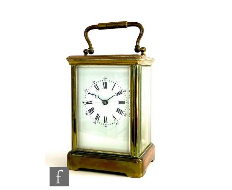 A 20th Century brass carriage clock, white enamel dial on bracket plinth base, height 13cm, S/D. 