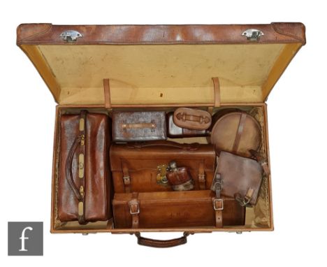 A collection of early 20th Century gentleman's travelling accessories to include a leather cased plated sandwich case and fla