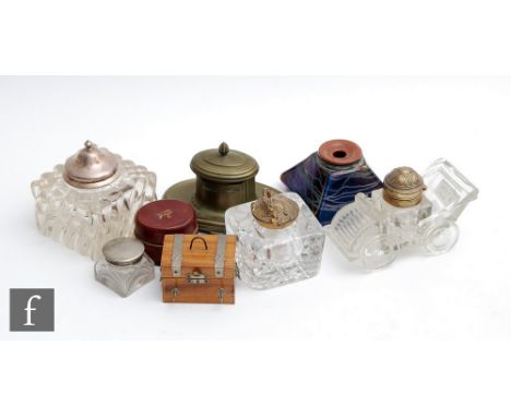 A collection of assorted ink wells of varying forms to include one modelled as a vintage car, one modelled as a chest etc. (8