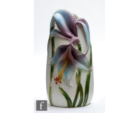 A later 20th Century vase in the Art Nouveau style, the white body with a moulded purple lily and green stems, marked CD to t