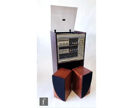 A vintage 1980s Amstrad tower system record player music system, model TS52/56, sold with instruction booklet, together with 