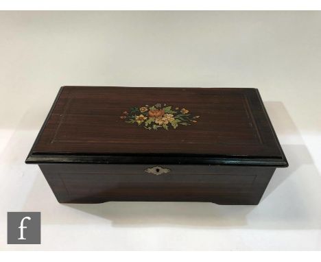 A musical box, serial No 16838, playing six airs, printed tune card, simulated rosewood case with floral transfer to lid, 36.