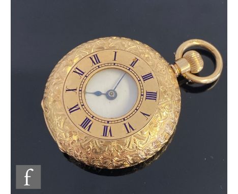 A 15ct half hunter crown wind pocket watch, Roman numerals to a white enamelled dial, case diameter 36mm, gold dust cover, no