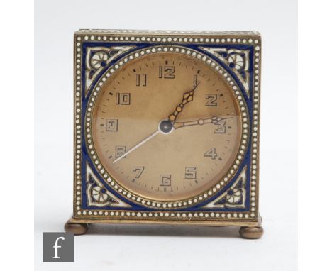 An early 20th Century alarm clock, Arabic numerals to a champagne circular dial all within an enamelled and gilt decorated ca