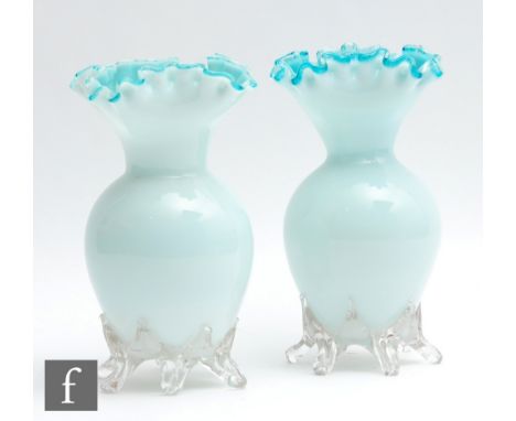 A pair of large late 19th Century glass vases of shouldered ovoid form with collar neck and frilled quatrelobed rim, cased in