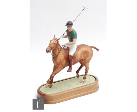 A boxed limited edition Royal Worcester equestrian study modelled by Doris Lindner of H.R.H The Duke of Edinburgh playing pol