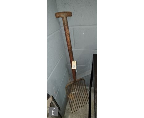 A 1930s clinker or track ballast eleven pronged fork, wooden handle stamped LNER 1935, Wigan &amp; Leeds Dreadnought, length 