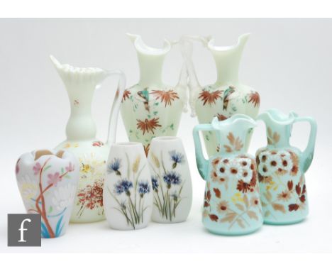 A small collection of late 19th Century continental glass ware to include ewers and posy vases all with hand enamelled decora