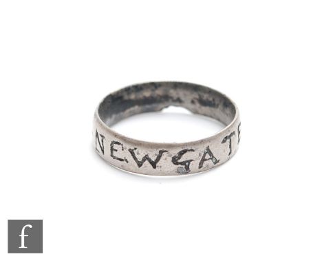 A 19th Century white metal finger ring stamped Newgate Prison with heart design. 