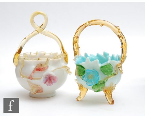 A late 19th Century glass posy basket of footed ovoid form in opal glass with applied amber trim and twisted rustic form hand