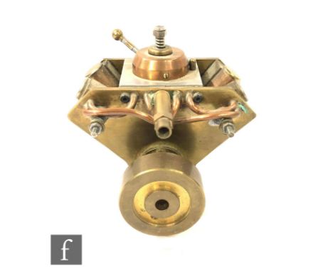 A marine type engine with four double acting opposing oscillating cylinders, constructed from brass, width 11cm. 
