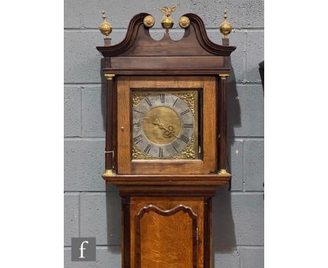 An 18th Century oak and mahogany cross-banded longcase clock with a thirty-hour movement striking on a bell, the hood with tw