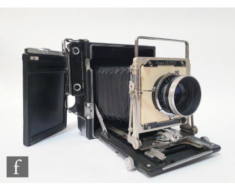 A Graflex Crown Graphic large format 4 x 5 camera, circa 1947, serial number 883018, fitted with Graflex Optar f/4.7 135mm le