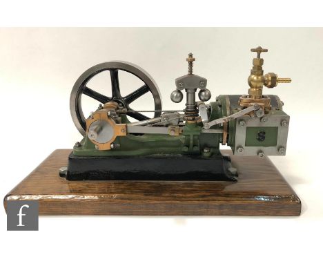 A Stuart single cylinder horizontal engine with ball governor and six spoked flywheel, painted in light green and black, rais