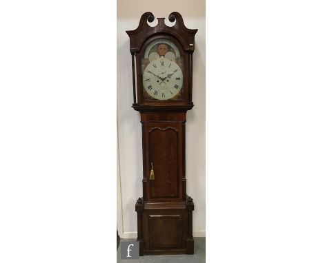 A 19th Century oak and mahogany longcase clock, the painted arch dial with moon phase, subsidiary seconds dial and date apert