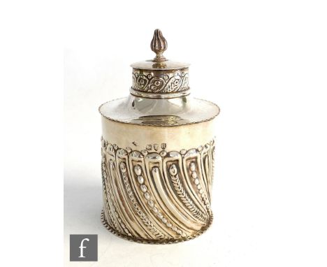 A hallmarked silver tea caddy of cylindrical part fluted form terminating in pull off lid with flame finial, weight 3oz, heig