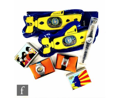 Two Beatles Swatch Yellow Submarine Scuba 200 watches, each complete with Swatch hard case and original inflatable submarine,