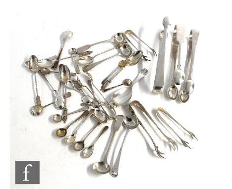 A parcel lot of assorted hallmarked silver flat ware to include a set of six apostle tea spoons, a caddy spoon, sugar tongs a