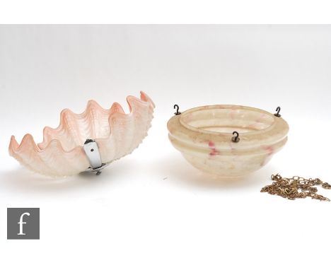 A 1930s Art Deco ceiling light fitting, the shade formed from three triform pink frosted and moulded shell form panels, with 