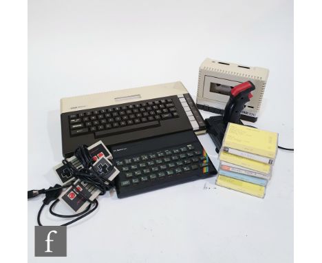 A collection of vintage gaming items, to include an Atari 800XL computer, with power supply, Atari 1010 cassette programme re
