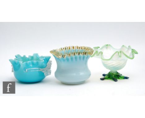A late 19th Century pedestal preserve dish of wrythen fluted form with a crimped rim and graduated opal to pale green tint, r