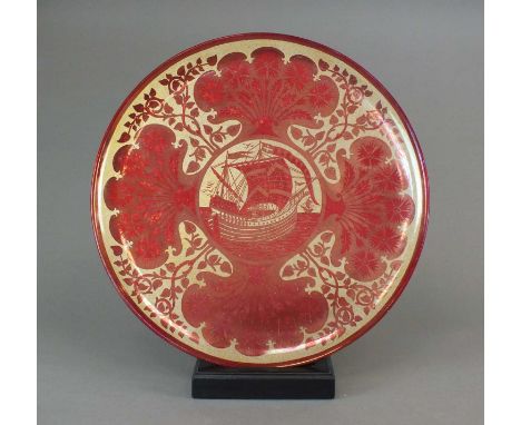 A Maw and Co earthenware ruby lustre charger circa 1885decorated with a design after William De Morgan with a circular panel 
