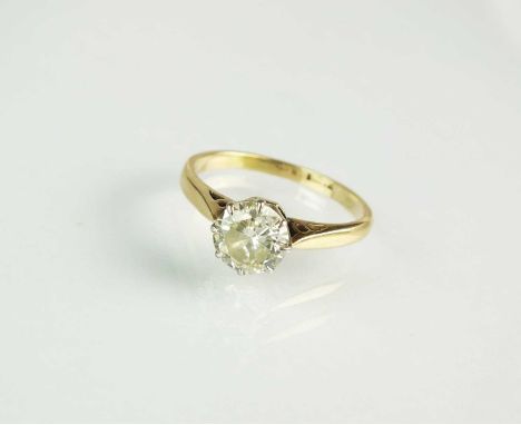 A single stone diamond ring, the brilliant cut diamond claw set in white metal to yellow metal mount, stamped '18ct', ring si