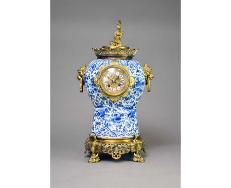 A Chinese taste brass mounted and Delft mantel clock, 18th and 19th centuryThe Dutch Delft vase body decorated with profuse f