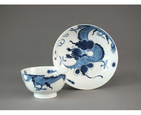 A Lowestoft porcelain tea bowl and saucercirca 1780painted in underglaze blue with the 'Dragon' pattern, the mythical beast p