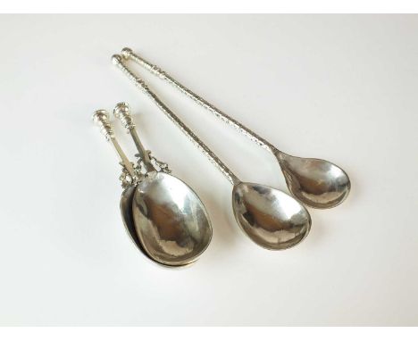 A pair of silver stylised caddy spoons by Amy Sandheim, London 1943, each 9.5cm long, together with a further silver spoon by