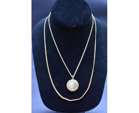 A yellow metal circular portrait pendant, 2.2cm diameter, on a yellow metal chain, 88cm. 