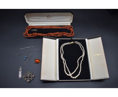 A cased pearl graduated two strand choker necklace, having gilt clasp stamped 925, 42cm; together with a long coral necklace,