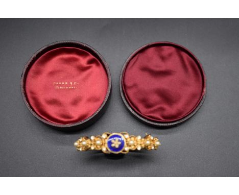 A vintage Florenza gold plated, enamel, pearl and paste hinged bangle. 