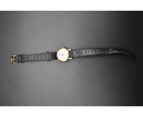 A vintage Swiss yellow metal manual wind ladies wristwatch,&nbsp;22mm, stamped '750', on leather strap. 