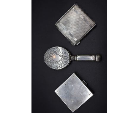 An engine turned silver compact, by W I Broadway &amp; Co, Birmingham 1946, 7cm; together with a plated minaudiere; and one o