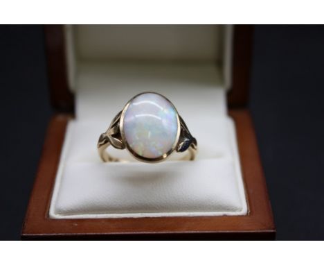 A 9ct gold and cabochon opal ring, size Q, gross weight 3.9g. 