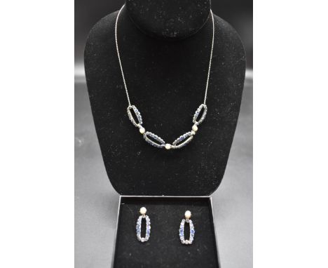 A blue paste and split pearl necklace and matching earrings. 