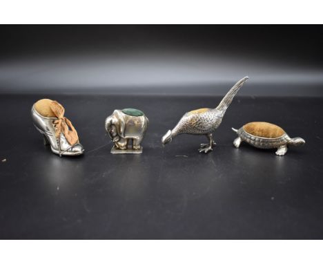 A silver pheasant pin cushion, by S&nbsp;Blanckensee &amp; Son Ltd, Birmingham 1913, 12.1cm; together with an elephant pin cu