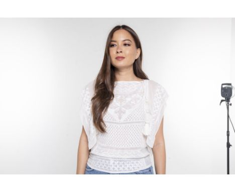 AN ISABEL MARANT WHITE SILK BLOUSE
Étoile white sheer silk blouse embroidered with floral and snowflake motifs, with a straig