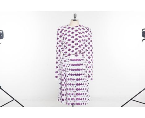 A PRADA LIP PRINT BLOUSE &amp; SKIRT
Two piece, white pink and purple lip print long sleeved blouse with self tie bow to the 