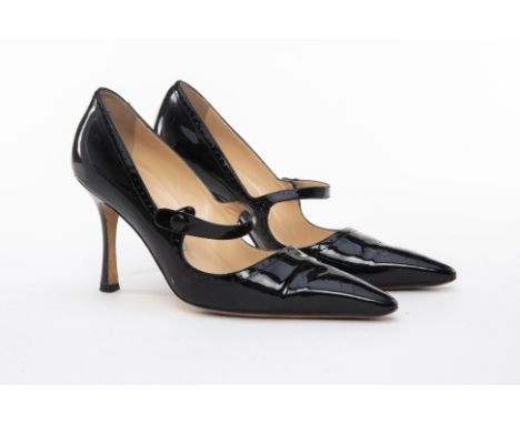 A PAIR OF MANOLO BLAHNIK BLACK PATENT LEATHER HEELS EU 38
Black patent leather stiletto heels with front strap and button enc