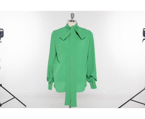 AN EMILIA WICKSTEAD 'BRUNHILDA' GREEN CREPE BLOUSE
Bright green mock neck light crepe blouse, with a singular pleat to the fr