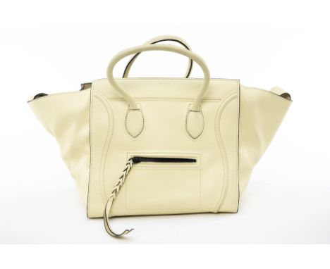 A CELINE 'PHANTOM LUGGAGE' PALE YELLOW TOTE
Bullhide calfskin large phantom luggage tote bag, with front pocket and braided z