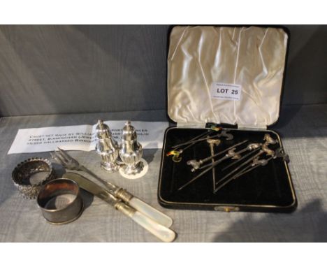 A pair of hallmarked silver cruets together with cocktail sticks, napkin rings and two mother-of-pearl handled serving items 