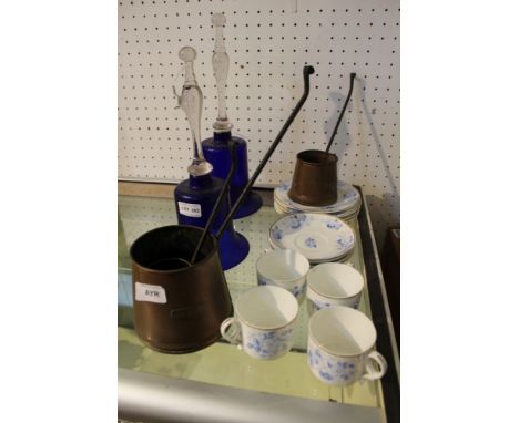Two decorative blue glass bells, together with a blue-and-white part tea service and a trio of copper measures&nbsp;